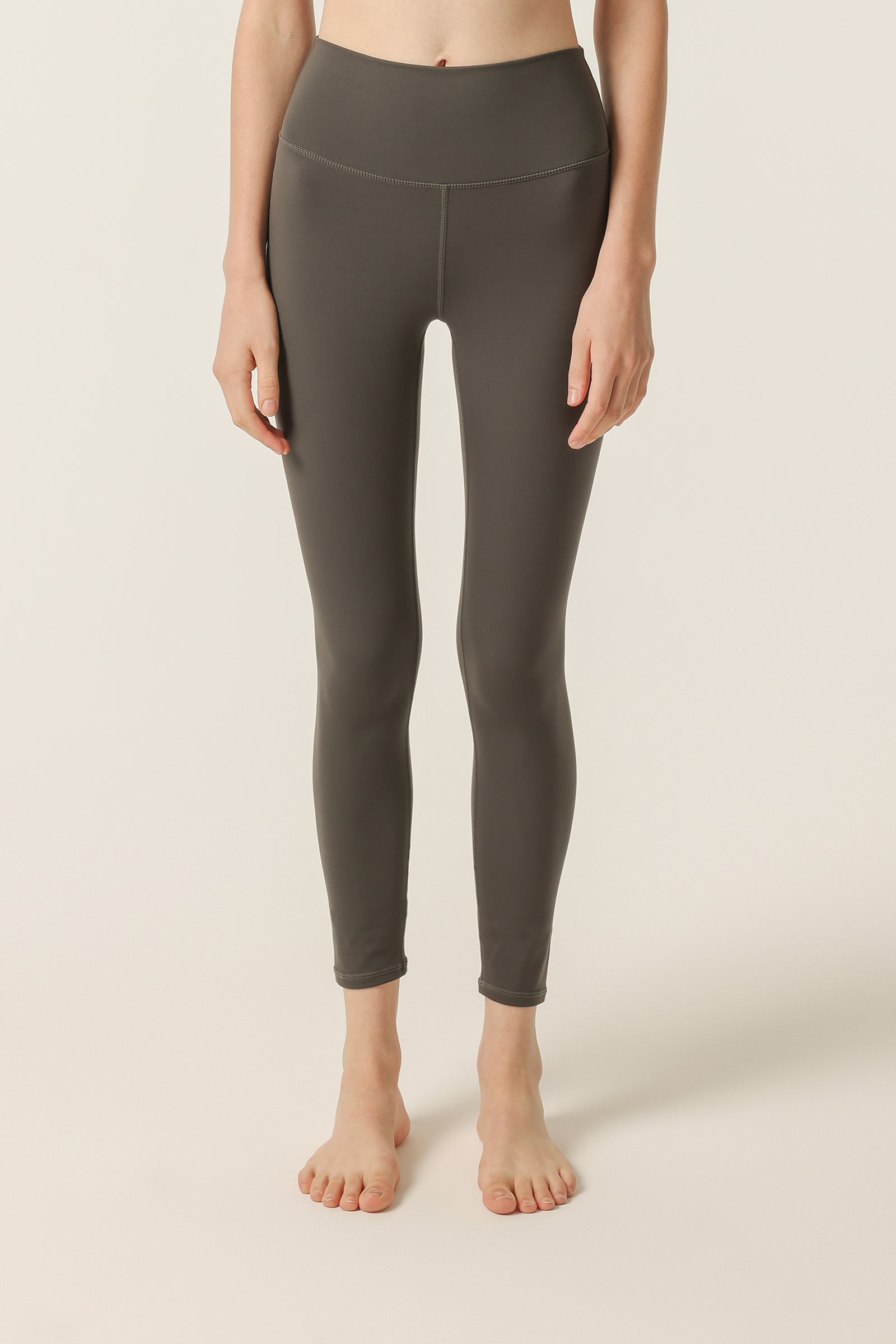 Nude Lucy Nude Active Tights In A Dark Grey In A Brown Coal Colour 