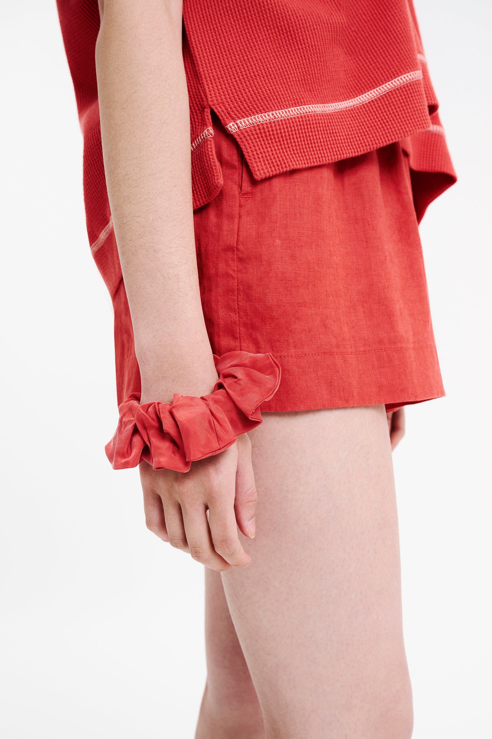 Nude Lucy Essential Cupro Scrunchie in a Pink & Orange Toned Coral Colour