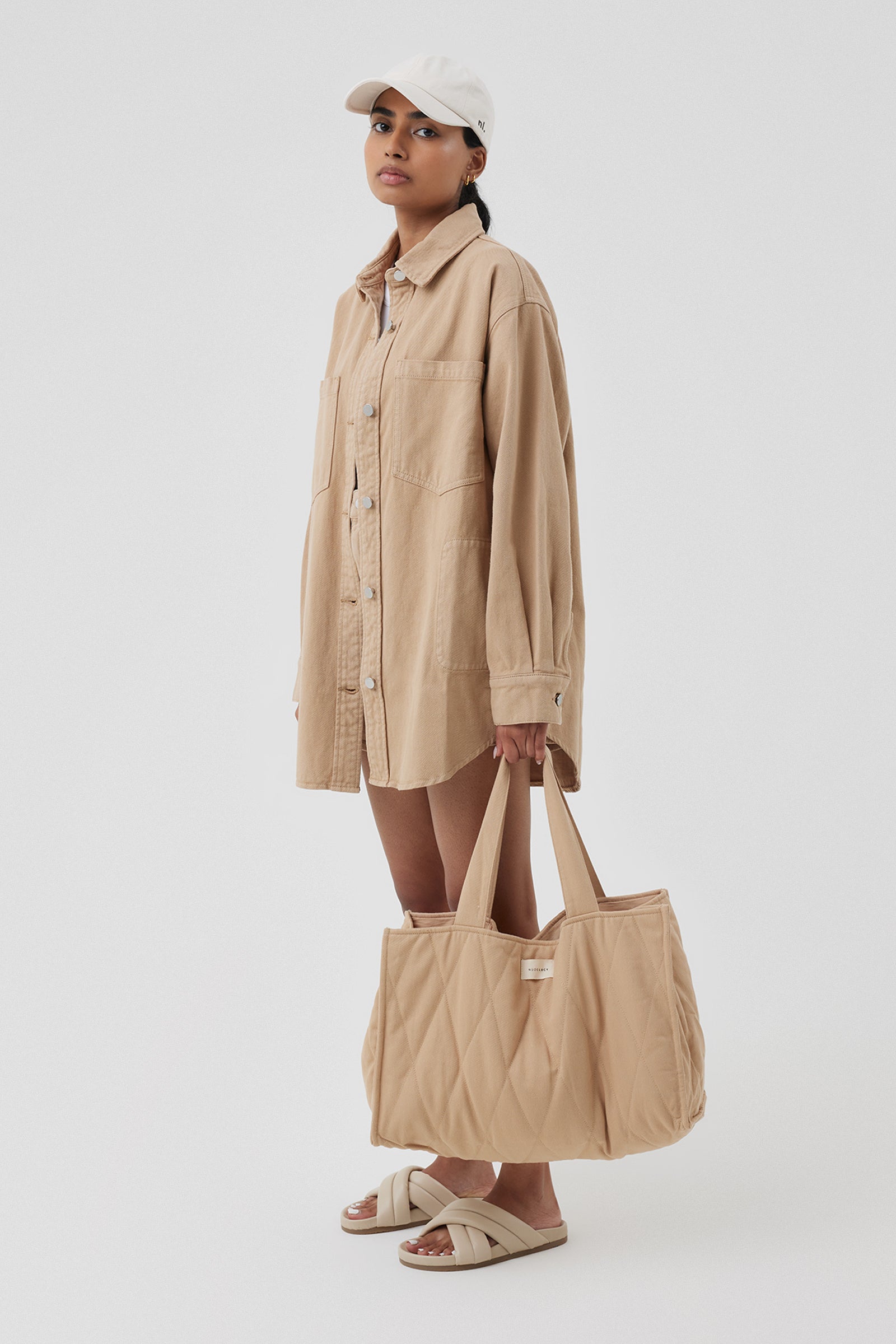 Nude Lucy Nude Puffer Bag In A Light Brown Biscuit Colour 