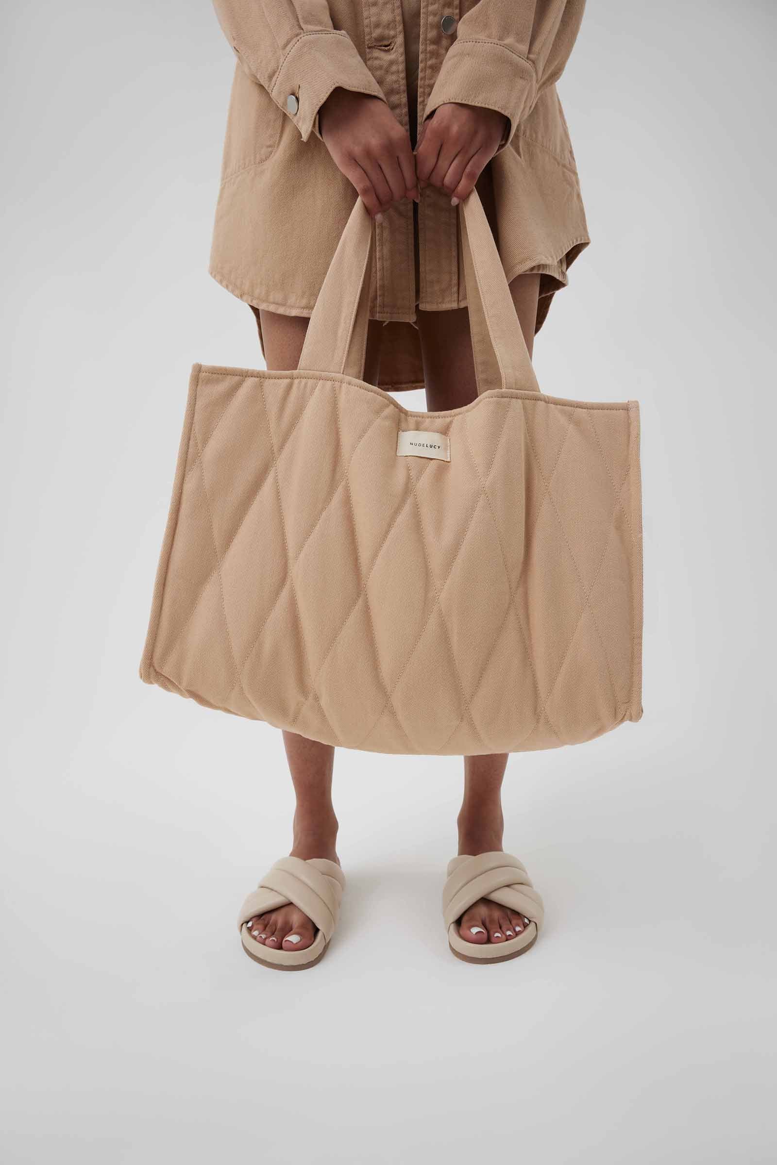 Nude Lucy Nude Puffer Bag In a Light Brown Biscuit Colour